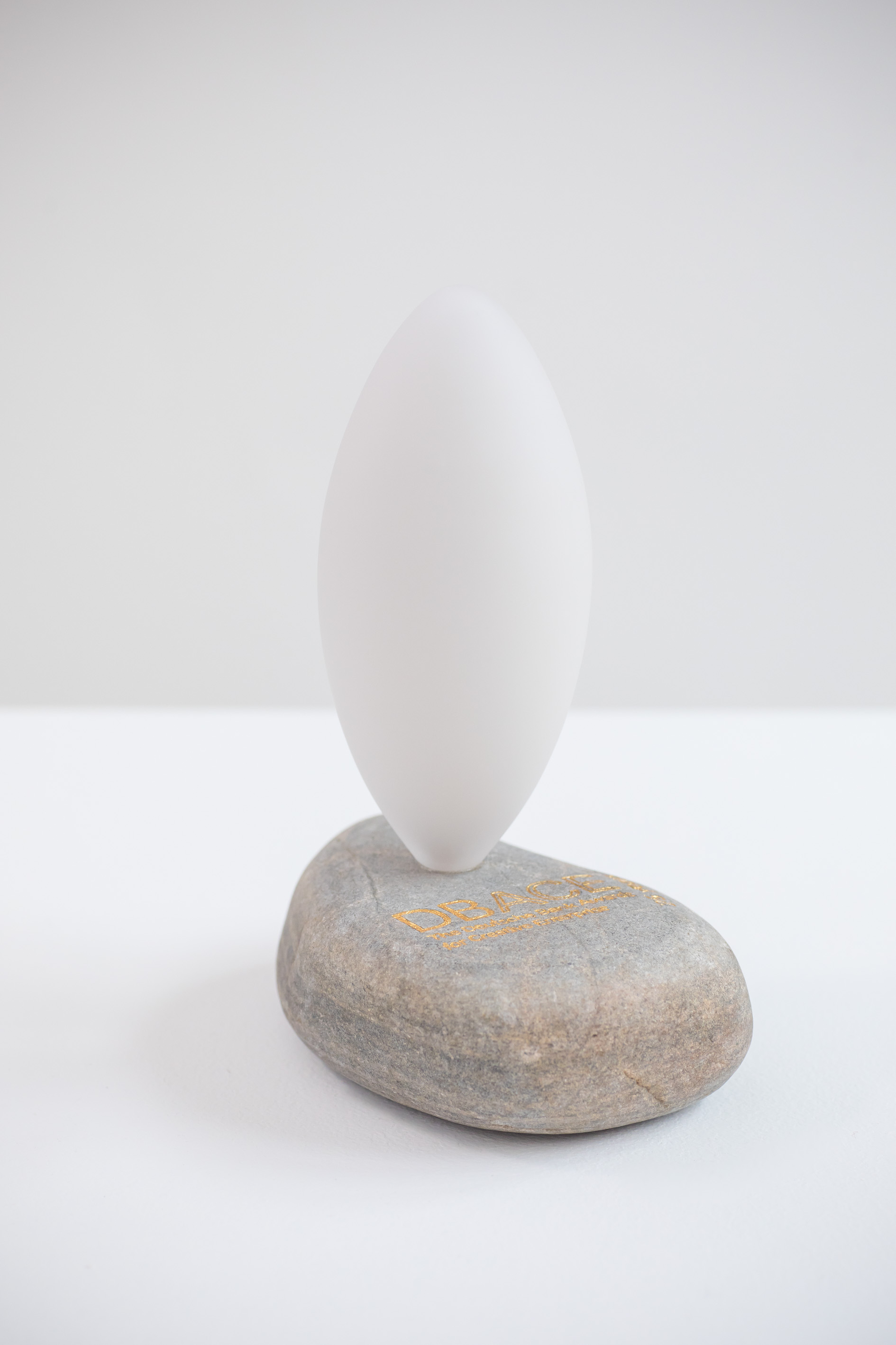 The Milestone, 2017, frosted handblown glass on found stone, engraved and gilded, approx 22x17x10cm rel=